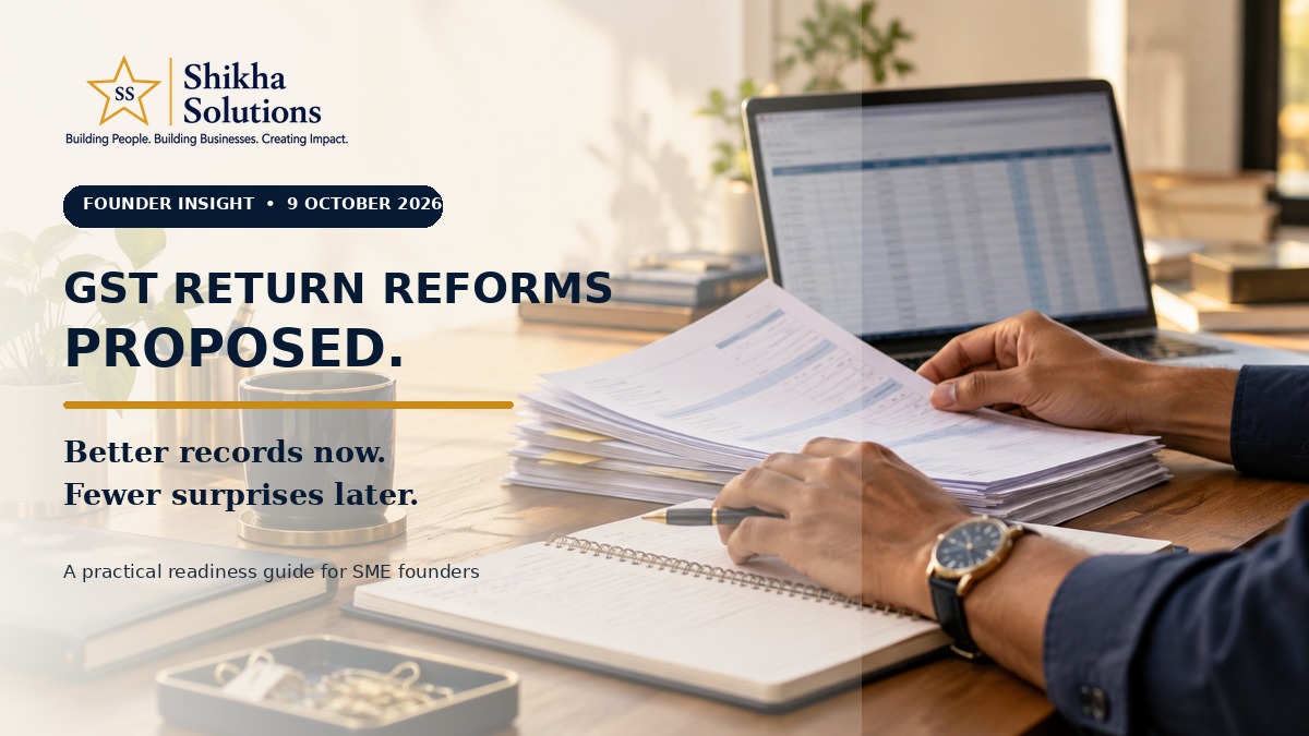 SME owner reviewing invoices and accounts on a laptop, illustrating record preparation for proposed GST return-process changes.